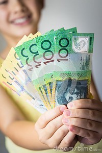 australian-currency-girl-holding-fifty-hundred-dollar-notes-38822802